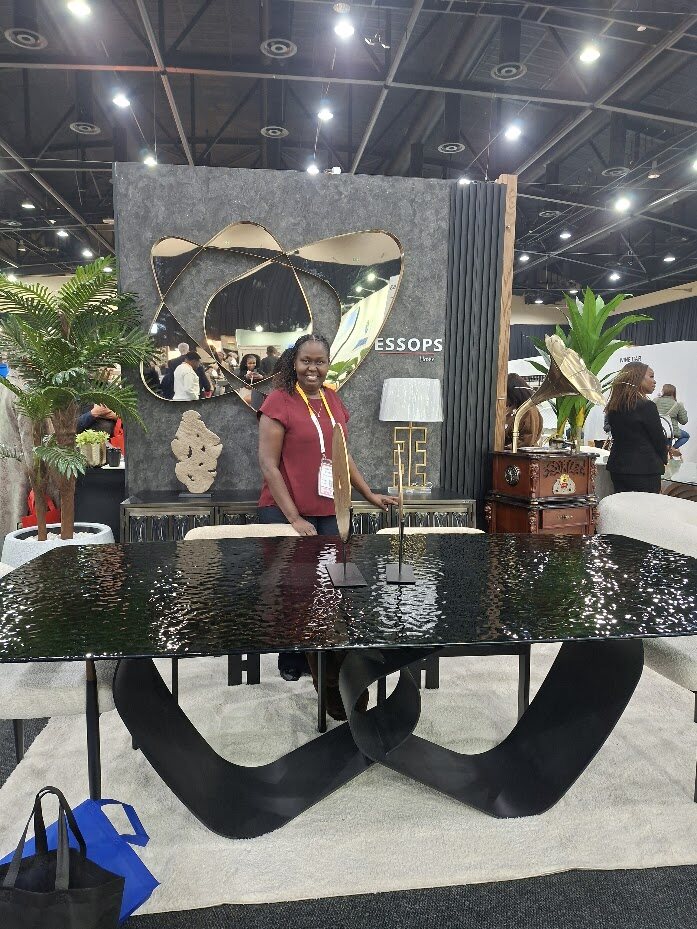 Sculptural dining table with hammered glass top at Decorex Joburg 2026